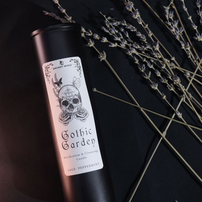 Close-up of the Gothic Garden candle label with skull, roses and butterflies