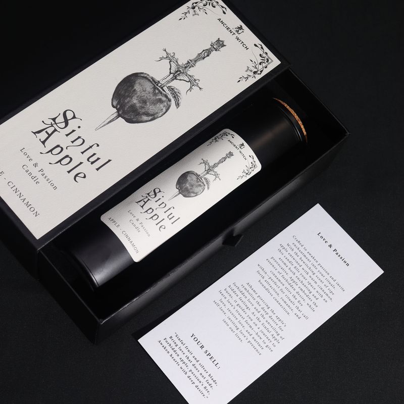 Sinful Apple ritual spell card beside the candle