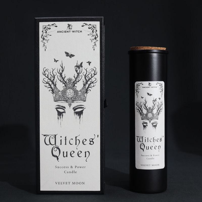 Witches’ Queen ritual candle and crowned-moth gift box on a black background